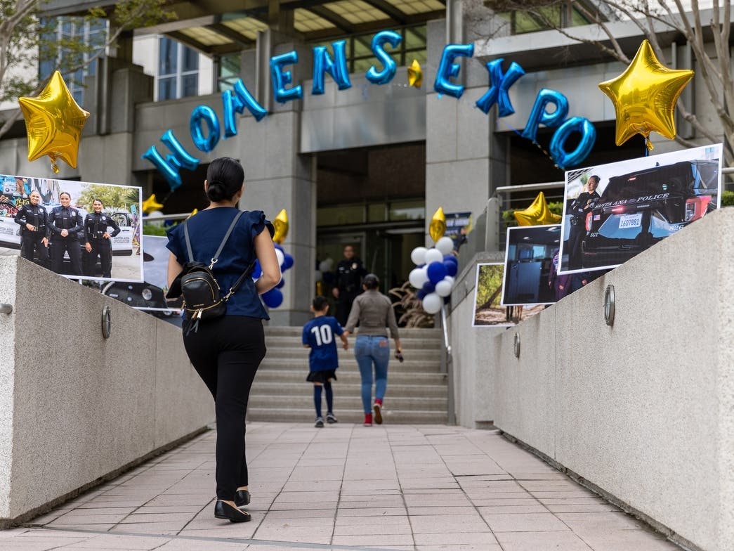 Women enter the Santa Ana Police Department headquarters for the women’s hiring expo on Saturday, October 1, 2022.