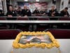A traditional U.S. Marine Corps birthday cake is used during roll call at Santa Ana Police Department headquarters.