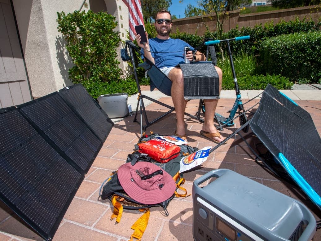 Austin Demski of Irvine with some of his emergency preparation supplies. 
