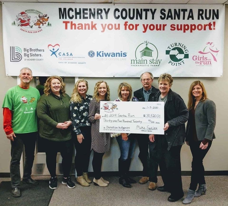 Pictured left to right: Mike Splitt-Kiwanis, Emiy Green-CASA, Kelsey Andersen-Big Brothers Big Sisters, Meghan Sullivan-CASA, Loriann Dowell-Main Stay, Frank Heisler-Kiwanis, Jane Farmer-Turning Point, Laurie Dayon-Girls On The Run.