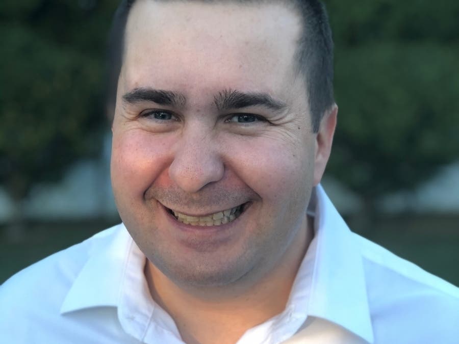 Viola, a correctional officer with the Middlesex Sheriff's Office, is one of seven candidates running for five school committee seats.