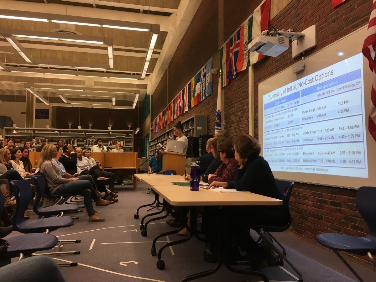 School committee members listen to public comments at a start times forum.