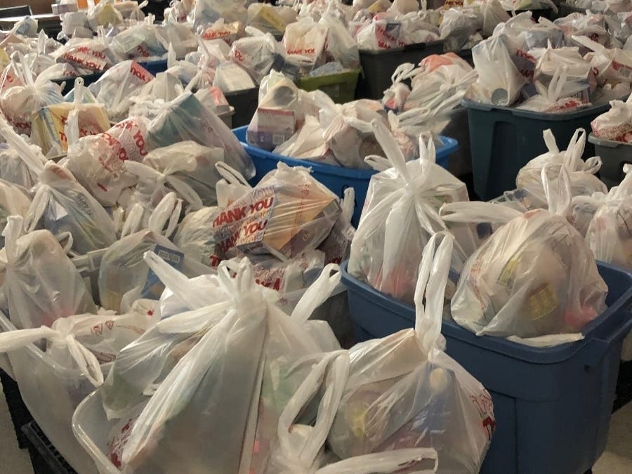 Lazarus House distributed 1000 bags of groceries, plus chicken and eggs, Wednesday.