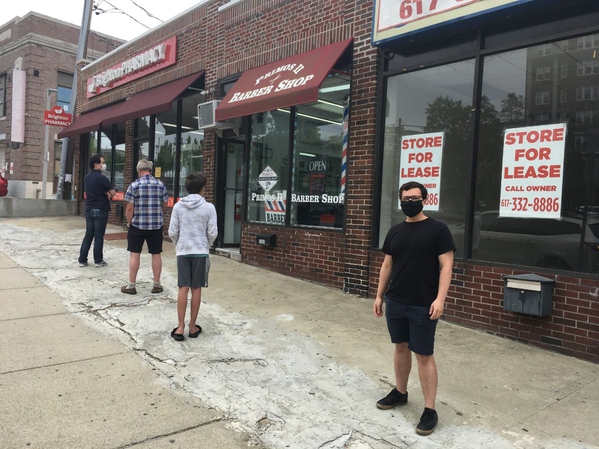 Diego Lopez, 24, in line to get his first haircut in months on the first day barbershops could reopen in Massachusetts, May 25.