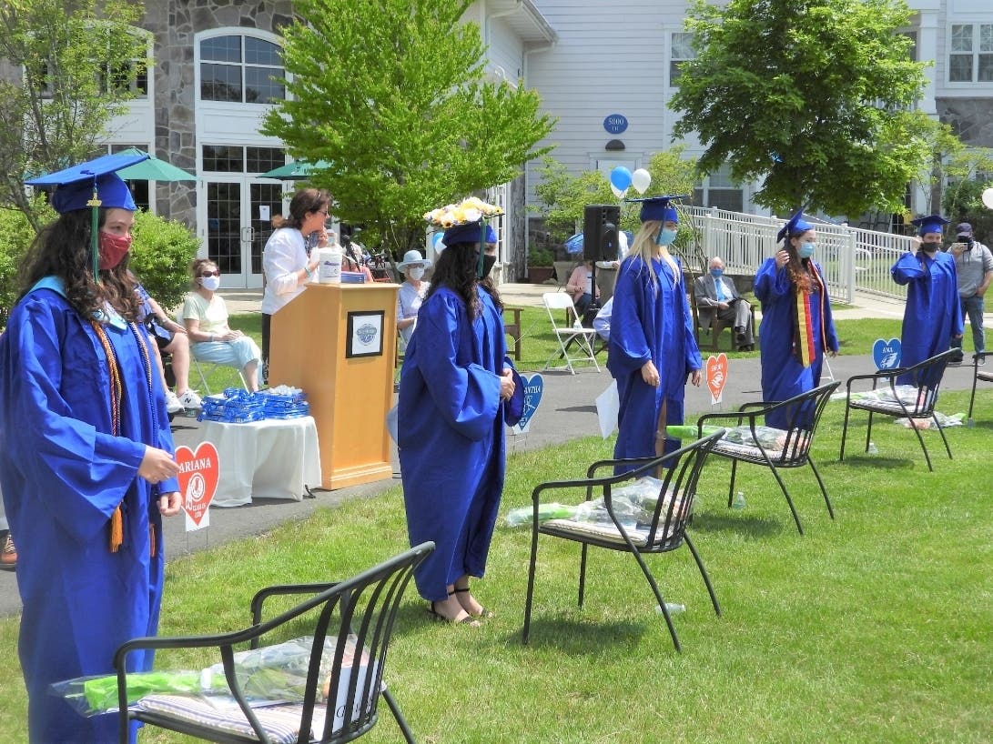 StoneRidge Executive Director Kathleen Dess addresses her part-time employees who recently graduated from local high schools and college.