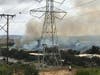 The brush fire burning in Carlsbad Friday afternoon near Palomar Airport Road.