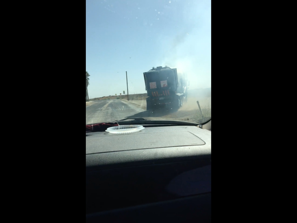 A screenshot from the video Shawn Melvin posted on Facebook Thursday, apparently showing the trash truck that ignited the Sandalwood fire. Used with permission.