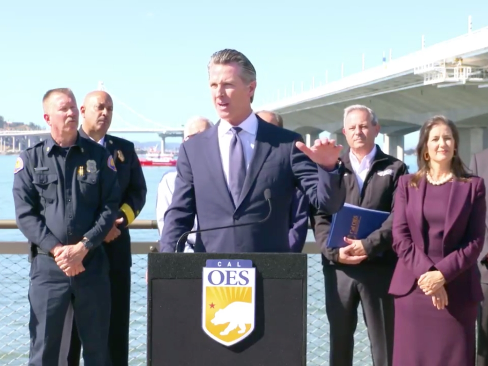 California Gov. Gavin Newsom speaks at a press conference Thursday in Oakland near the Bay Bridge, announcing the state's new earthquake early warning system.
