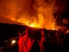 Firefighters confer while battling the Kincade Fire near Geyserville, California on Thursday.