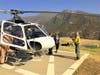 Mary Joanna Gomez and a rescue team landed at a base after her rescue on Monday.