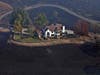 A home between Healdsburg and Windsor, Calif., on Tuesday, Oct. 29, 2019, is surrounded by charred ground but was spared from the Kincade Fire flames. 