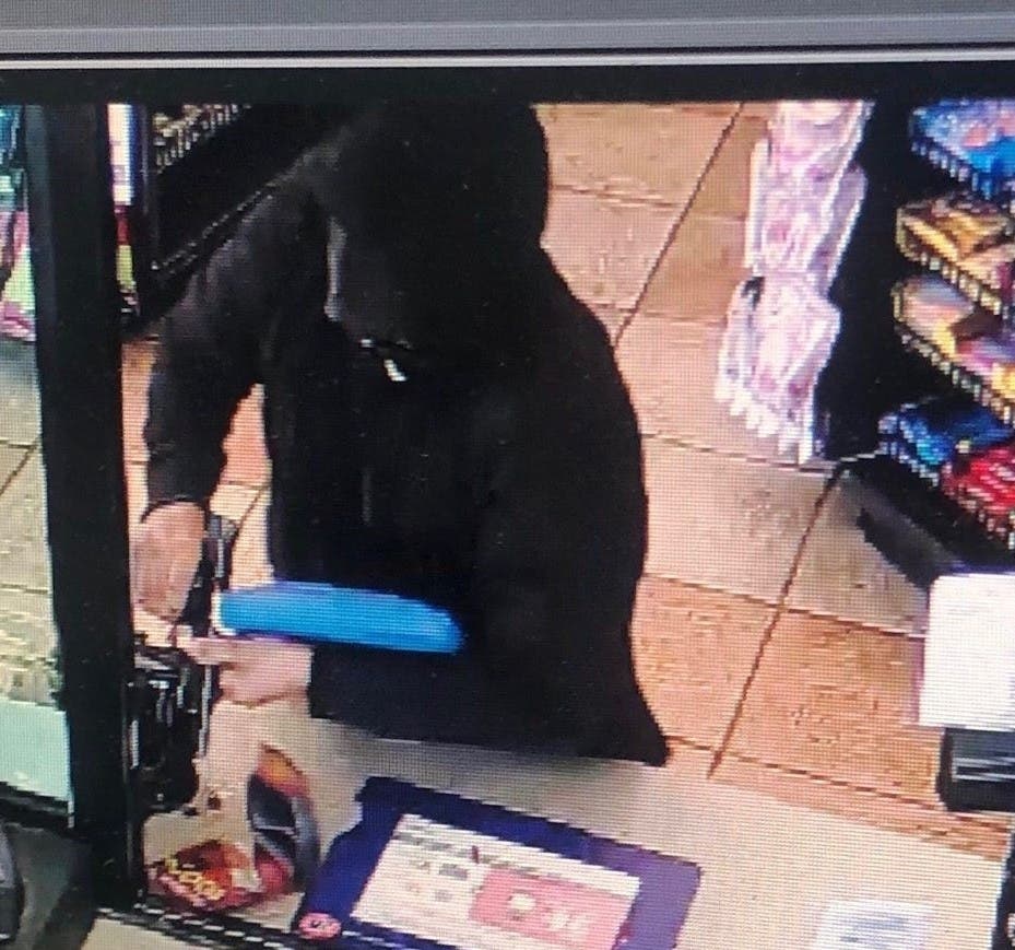 Employees said that a Hispanic man wearing a black hooded sweatshirt, a black bandanna and a blue bag showed a handgun and demanded cash.