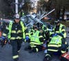 Menlo Park Fire paramedics attempt to rescue a woman whose car was struck by an express train in Menlo Park. Paramedics accompanied her to Stanford Hospital, but she died from her injuries.