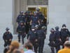 California Highway Patrol officers in riot gear stand during a protest against police violence at the State Capitol in Sacramento, June 1, 2020.