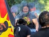 One woman waves cultural blessing smoke over a man during a protest against police violence at the State Capitol in Sacramento, June 1, 2020.