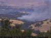 Wildfire cameras showed large plumes of smoke rising from the area Sunday afternoon.