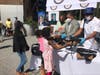 L-R: Exonerated Five Member Korey Wise, Congressman Adriano Espaillat and City Councilmember Bill Perkins helped give away school supplies and backpacks in Schomburg Plaza on Thursday, Aug. 20, 2020.