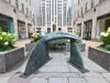 French artist Camille Henrot's "Inside Job" is a bronze sculpture installed in Rockefeller Center's Channel Garden. It evokes the shape of a shark, or the beak of a bird, and explores themes of tenderness and threat, according to a news release.