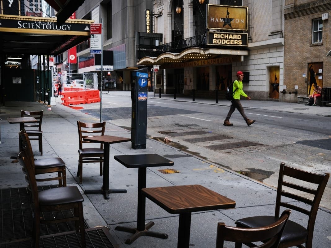 Broadway theaters stand closed along an empty street in the theater district on June 30, 2020 in New York City. 