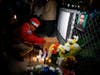 A member of the Guardian Angels attend a vigil for NYPD officer Randolph Holder outside the Wagner Houses community center #5 October 21, 2015 in East Harlem.