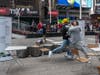 A Trump supporter and Trump protester get into a physical altercation at a rally and march for President Donald Trump at Times Square on October 25, 2020 in New York City.