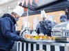 Staff at Lenox Hill hospital were treated to 400 "gourmet hot dogs" served to them personally by Vongerichten (left), whose upscale restaurant at The Mark hotel sits just two blocks west.