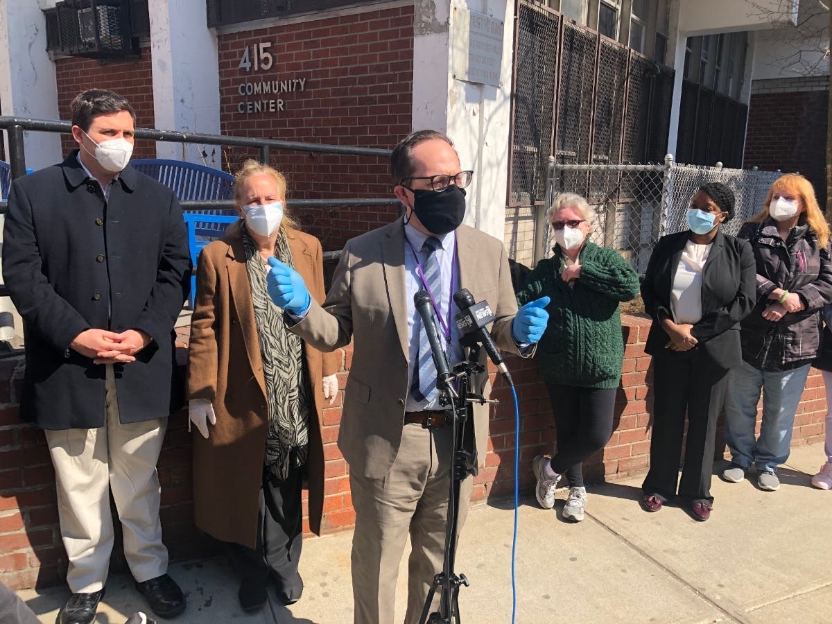 Isaacs Center President Gregory J. Morris speaks at Thursday's opening of a new vaccine site, serving senior citizens who live in the Isaacs Houses and Holmes Towers.