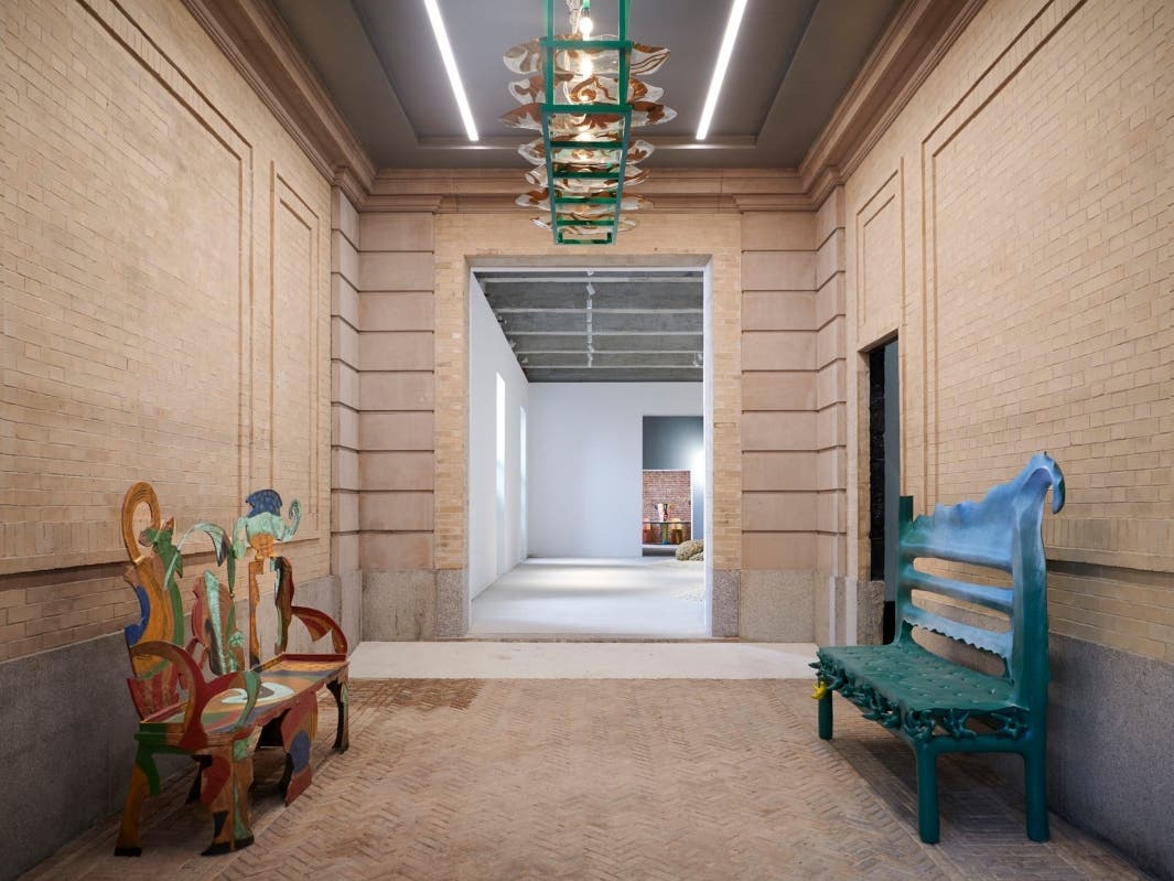 A bench and chandelier by Betty Woodman and a bench by Thomas Barger sit in the entranceway at Salon 94's new home on East 89th Street.