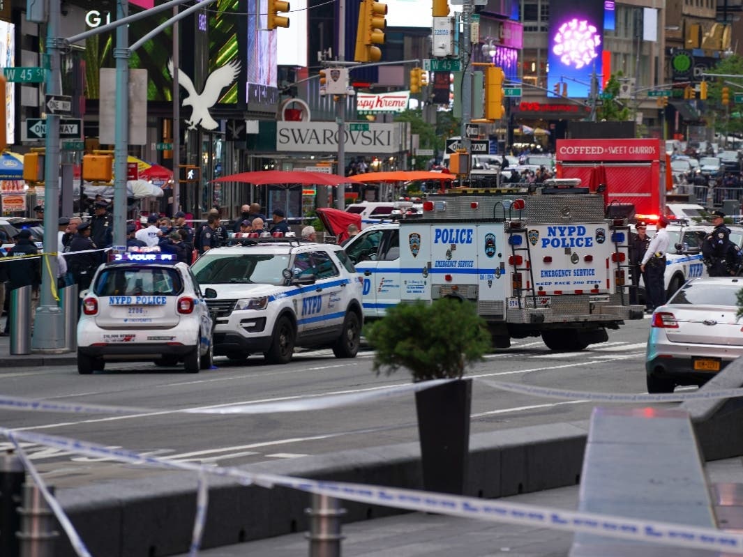 Police officers are seen in Times Square hours after the shooting on May 8, 2021.