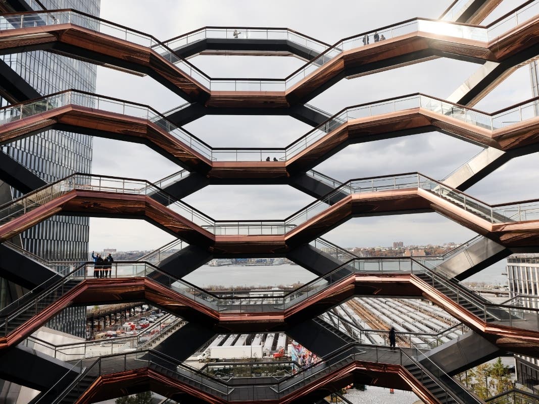 People walk the stairs of the Hudson Yards Vessel on Nov. 17, 2020. After closing indefinitely in January following a third suicide, it will reopen for Memorial Day weekend.