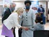 First Lady Dr. Jill Biden (C) and Dr. Anthony Fauci (L), Director of the National Institute of Allergy and Infectious Diseases, speaks with a person getting vaccinated at Abyssinian Baptist Church on June 6, 2021 in New York City.