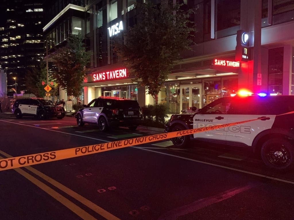 A woman was shot and killed inside Sam's Tavern in Bellevue on Monday evening in what police believe was an act of domestic violence. 