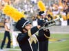 Rachel Ray, the Secretary of the new Marching Owls Alumni Society, on the field with "The Marching Owls." 
