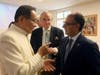 Dr. Hong, Tao-Tze, President of FOWPAL, left, and Ambassador Yusuf Abdulkarim Bucheeri of Bahrain to the UN (Vienna), exchange ideas about celebrating the United Nations' designation of April 5 as the International Day of Conscience.
