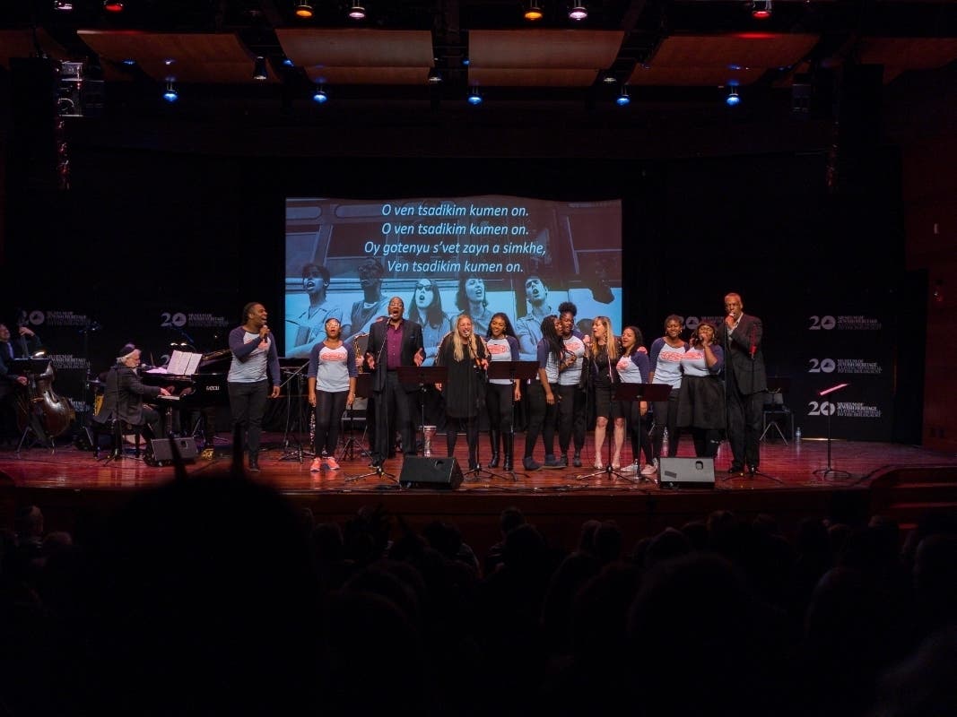 All performers on stage with youth from IMPACT Repertory Theatre