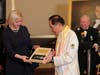  Dr. Hong, Tao-Tze, president of FOWPAL, right, presents the “Key to the Heart” to Irina Vlah, governor of ATU Gagauzia, Moldova. The key symbolizes that conscience is the key to a peaceful world.