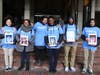 Roxbury Prep Principal Titciana Barros (third from left) stands with students holding 1,500 self portraits that were delivered to the mayor and city councilors.