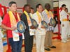 Dr. Hong, 3rd from left, presents the “compass clock of conscience” to, from left, Juan Ramon Lau Quan, MP of Guatemala; President of Burundian Constitutional Court Charles Ndagijimana; President of Burkina Faso’s Constitutional Council Kassoum Kambou.