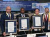 From left, Ali Gedikoglu, president of COJEP International, Hugues Sanon, UN representative of COJEP International, and Dr. Hong, Tao-Tze, president of FOWPAL, are honored by New York State Assemblymember Philip Ramos at the UN in New York.