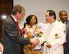 Dr. Hong, Tao-Tze, president of FOWPAL, right, is honored by Rhode Island Lieutenant Governor Daniel Mckee for fostering a culture of conscience, love, and peace at a gala dinner in New York, Feb. 19, 2020.