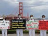 Tai Ji Men dizi hold signs to demand the Taiwanese government to end its human rights abuses against Tai Ji Men by the Golden Gate Bridge in San Francisco on August 16, 2020. 