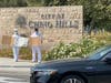 Tai Ji Men dizi hold signs on a sidewalk in Chino Hills to denounce the Taiwanese government’s persecution of Tai Ji Men on August 16, 2020.