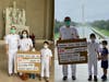 Tai Ji Men dizi James and Vivian and their children hold a sign to denounce the Taiwan government’s human rights abuses against Tai Ji Men in front of the Washington Monument and in the Lincoln Memorial on August 16, 2020. 