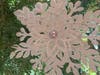 The Northport Snow Flake hangs in Northport to shine on Earnings Equality