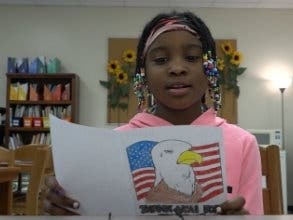 Pictured: Irene King student reads letter to veterans.