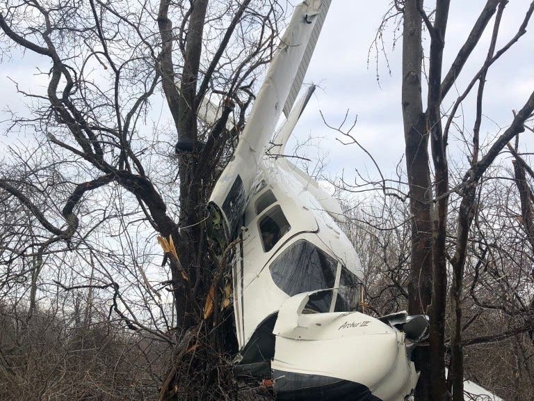 A Piper PA-28 ran off the end of Runway 27 and collided with trees at Beverly Airport around 4:20 p.m.​