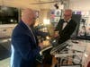 Mike Rodgers hands Craig Knapp ‘Educator of Note’ Award. 