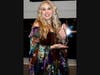 Candice Night accepting her LIMEHOF inductee award trophy. 
