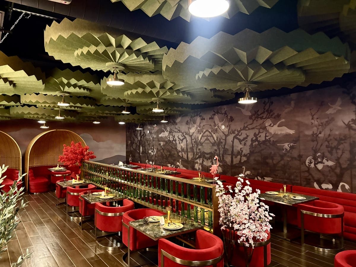 The Secret Kitchen’s Schaumburg dining room blends bold design—crimson velvet, carved botanical murals, and sculptural lotus ceilings—with a globally inspired modern Indian menu in its U.S. debut.