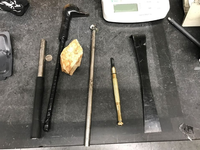 Police say a man was caught breaking into a local gas station with the tools pictured.